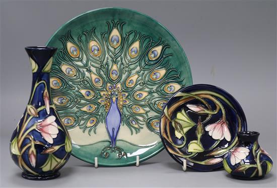 A Moorcroft 1994 Peacock year plate, two Wood Sorrel vases and a dish Largest dish, diameter 22cm